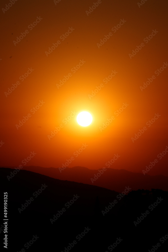 Fototapeta premium Sunset and mountains. Sky, sunrise orange