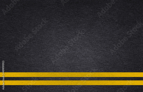 Yellow line on road. Line marking on road texture background. Pavement. Driveway. © Octavio