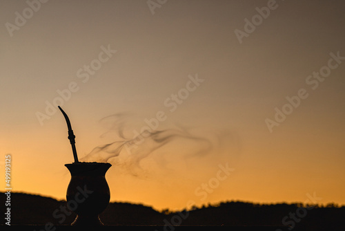 Chimarrão gourd at sunset, yerba mate infusion, served on cold winter days, gauchá tradition, symbol drink of Rio Grande do Sul, Brazil photo