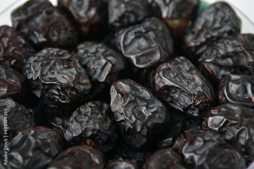 Arabic dates, ajwa dates on the white
Arabic dates, ajwa dates on the white