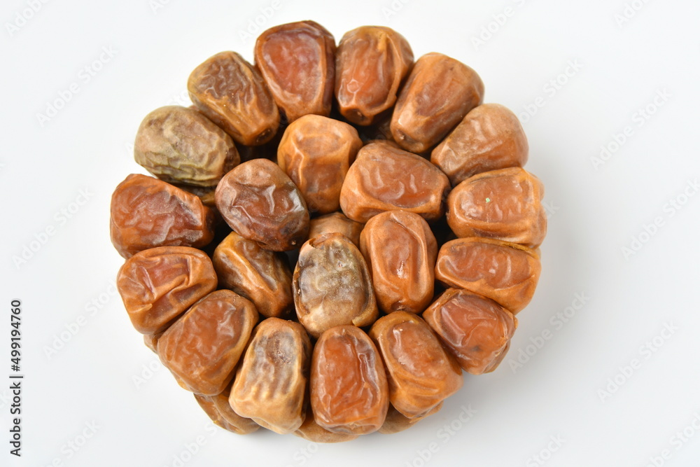 Obraz premium Arabic dates, sugary dates on the white 