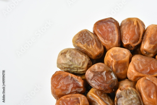 Arabic dates, sugary dates on the white 