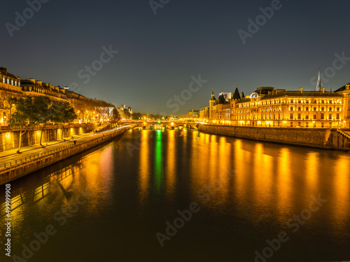 Seine river and the Louvre Castle illumiated at night
