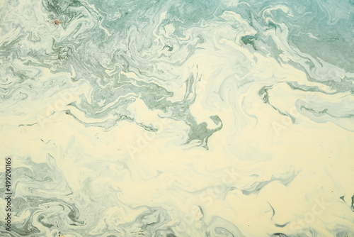 A background for design, spoiled and dirty waves on an oily liquid.