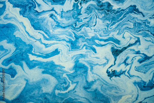 Artistic waves oil on water background.