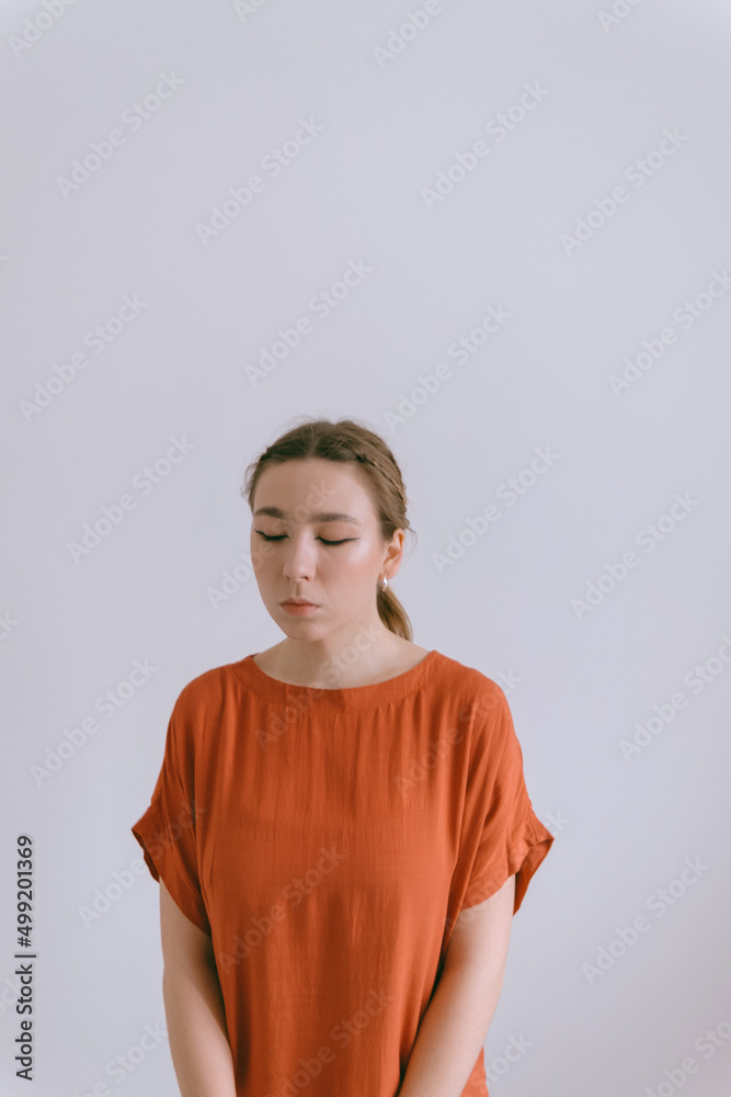 Portrait of young caucasian woman in red cloth. Portrait of young caucasian woman in red cloth.