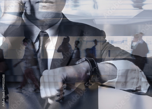 Tablou pe pânză Businessman in a rush checking his watch clock