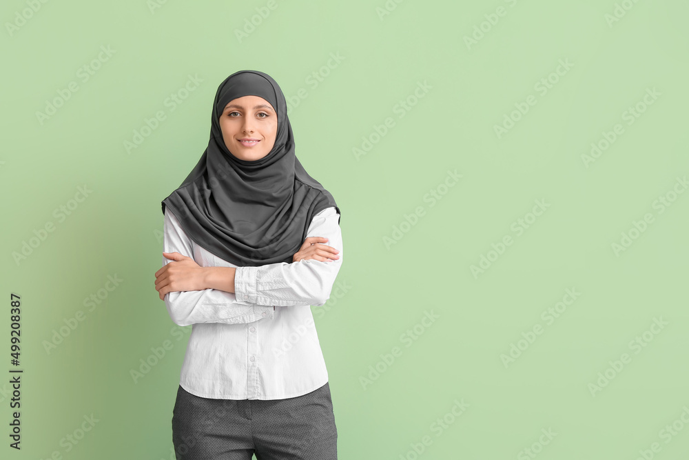 Muslim secretary on color background Muslim secretary on color background