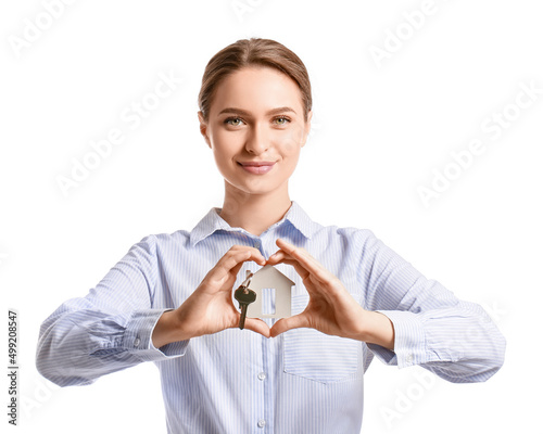 Young woman making heart wi...