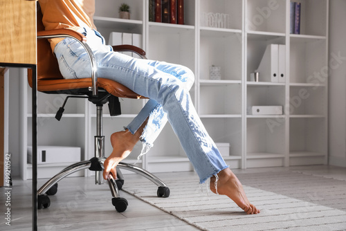 Barefoot legs of young woma...