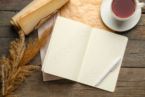Notebook, old paper, cup of...