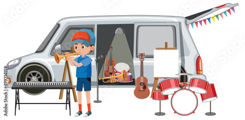 Boy playing trumpet by the van