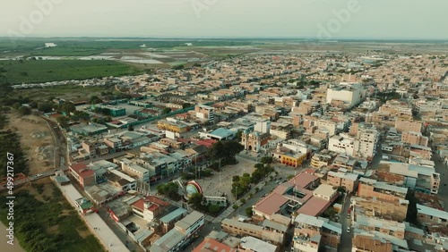 Aerial shot at sunset of the square and city of Tumbes, Peru