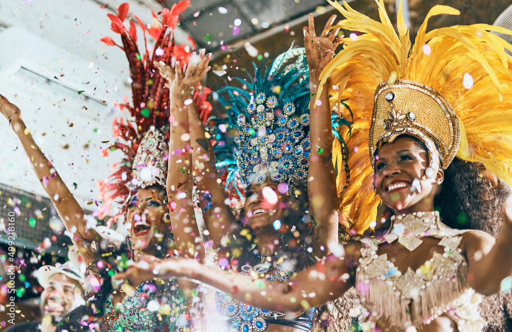 Lets dance all our troubles away. Cropped shot of beautiful samba dancers performing in a carnival with their band. - obrazy, fototapety, plakaty 