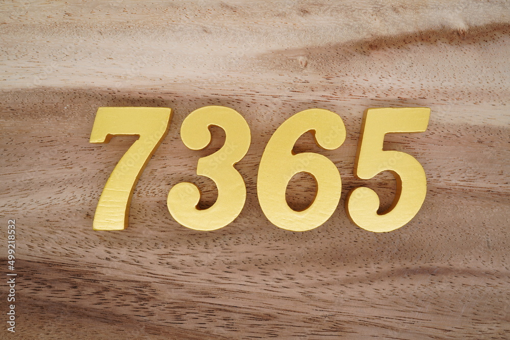 Poster Golden Arabic numerals on a real brown and white wooden floor ...