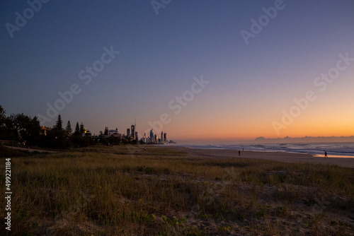 Beach Sunrise with People and Buildings Orange Sky Gold Coast Australia