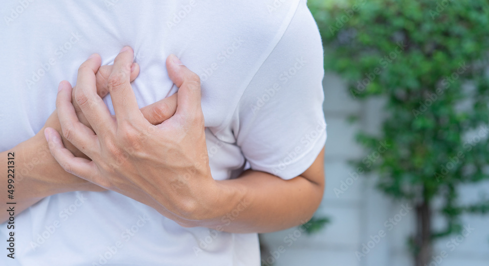 close up man feeling suffering and using hand for touching on chest for checking about his heart attack symptom suddenly for mental health care concept close up man feeling suffering and using hand for touching on chest for checking about his heart attack symptom suddenly for mental health care concept