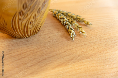 household utensils in the kitchen, rolling pin, wooden mug, kitchen decor