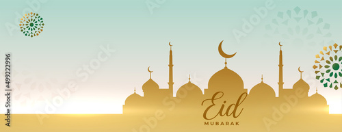 eid ul-fitr mubarak banner with mosque and arabic decoration