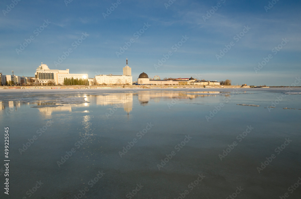 View of the city of Arkhangelsk. Reflection of the city in the water. ancient fortress