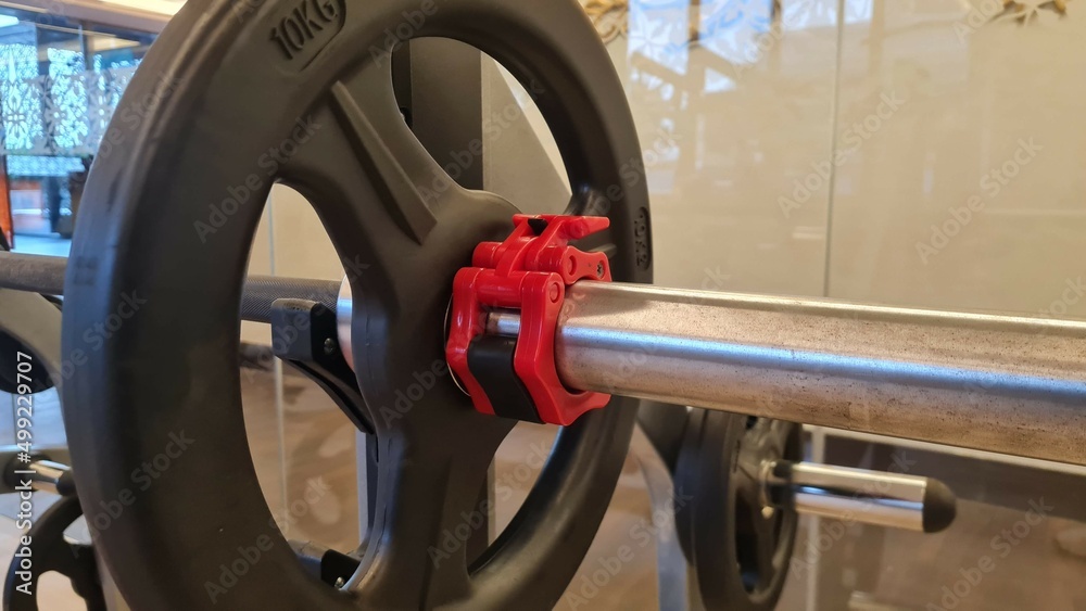 barbell weight disc with plastic barbell lock in gym barbell weight disc with plastic barbell lock in gym