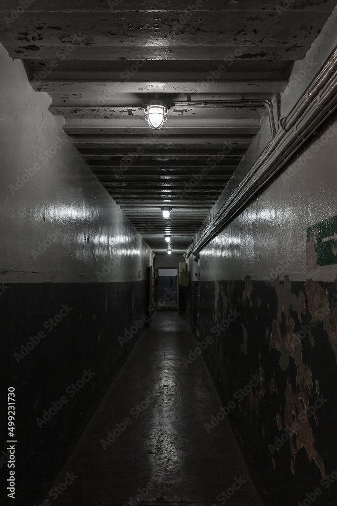 Underground military bunker corridor, dark interior
