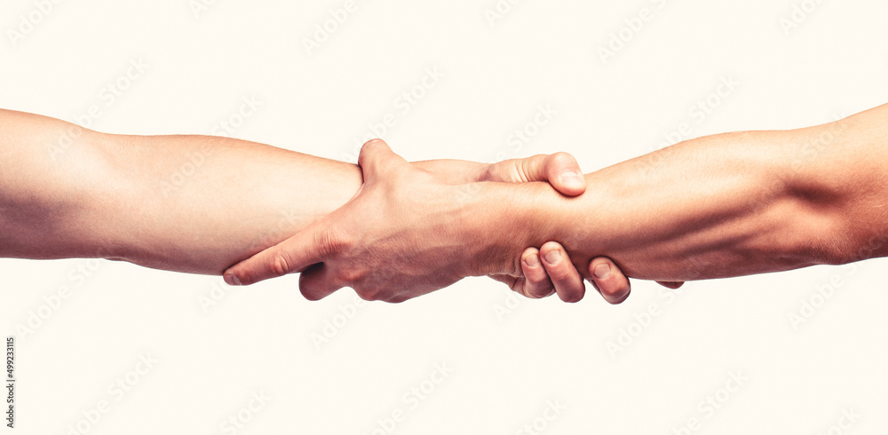 Fototapeta premium Helping hand concept and international day of peace, support. Closeup. Helping hand outstretched, isolated arm, salvation. Close up help hand. Two hands, helping arm of a friend, teamwork