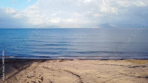 Unbelievable aerial view flight slider fly sideways from left to right drone footage of the coastline of
natural golden sand Bouka Beach at Corfu Greece 4k Cinematic view above by Philipp Marnitz 2022 photo