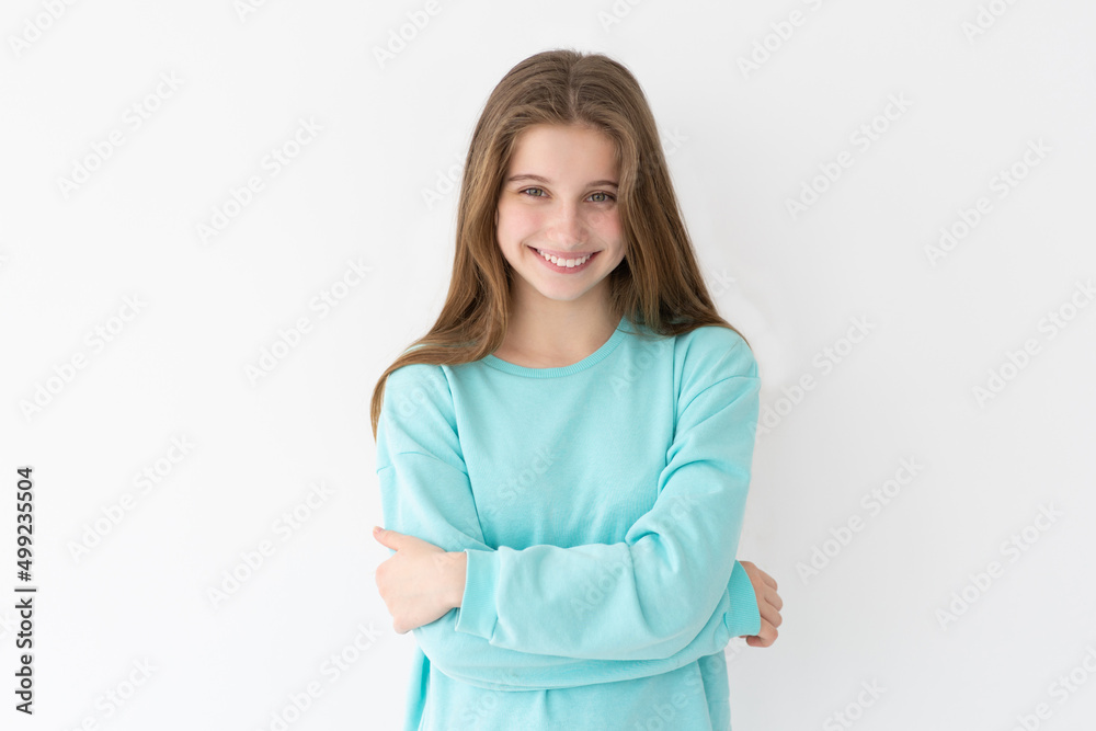 Portrait of smiling teenage girl on a wall background Portrait of smiling teenage girl on a wall background
