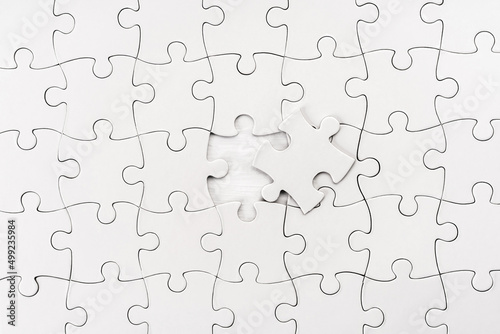 Close up view of unfinished jigsaw puzzle photo