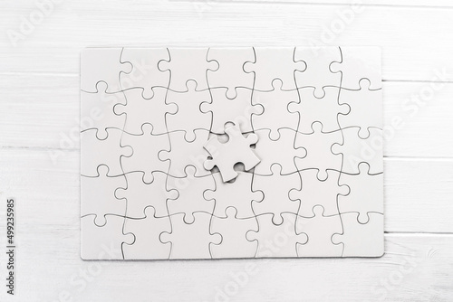 Top view of white jigsaw puzzle photo
