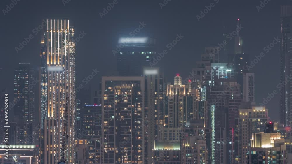 Panoramic skyline of Dubai with business bay and downtown district night timelapse. Panoramic skyline of Dubai with business bay and downtown district night timelapse.