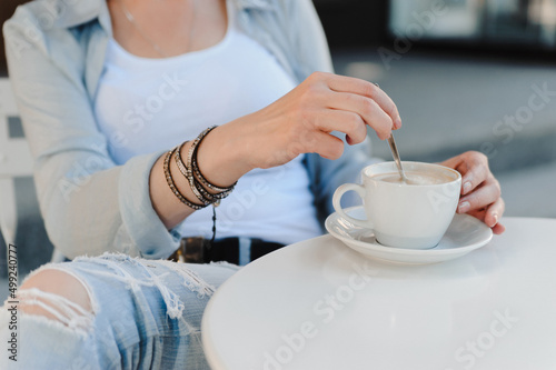 Woman enjoying coffee in the morning. Breakfast in a cafe