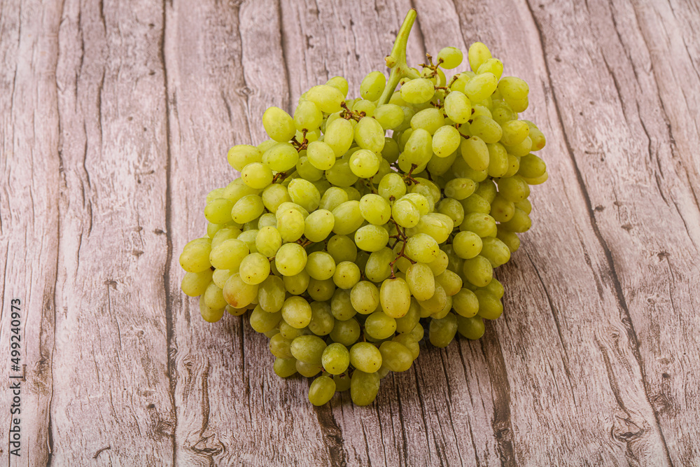 Green grape branch over background Green grape branch over background