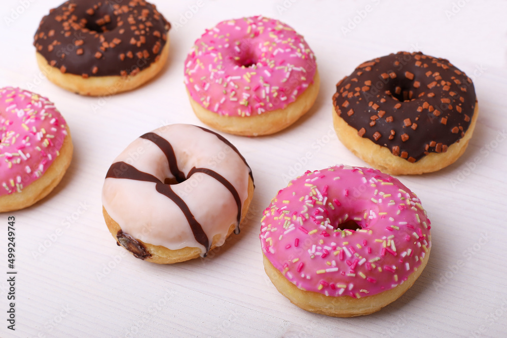donut with sprinkles, Pink donats, Sweet breakfast. Stack of pink and white donats