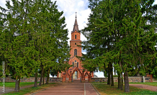 General view and architectural details of a close-up of the Catholic church of St. Michael the Archangel built at the turn of the 19th and 20th centuries in Jabłonka Koscielna in Podlasie, Poland. photo