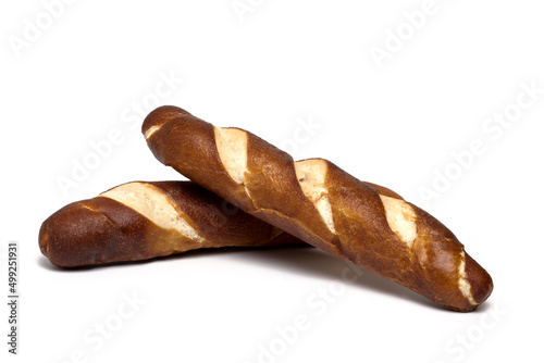 Closeup two bread sticks stacked white background photo