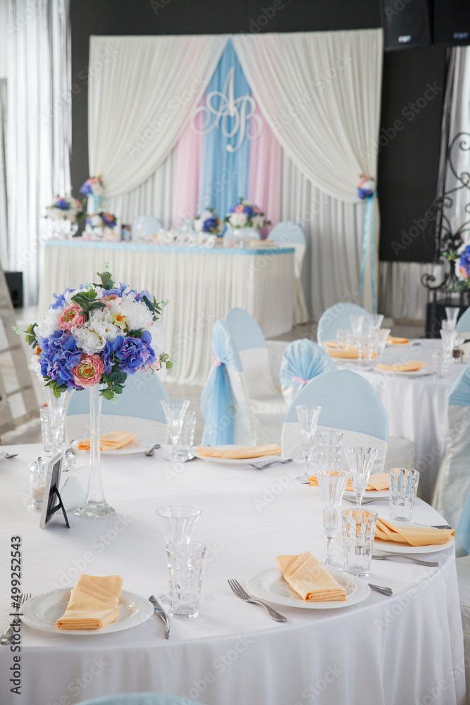 Restaurant wedding table setting in white tones 