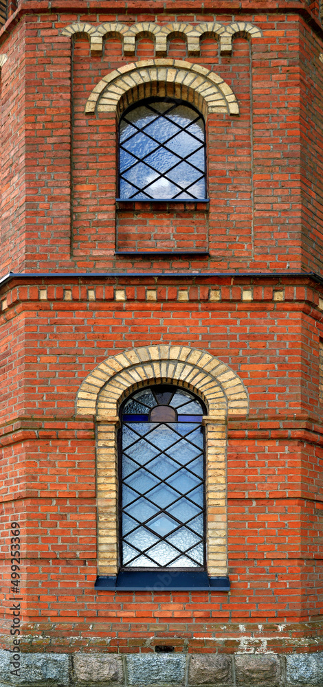 Obraz premium General view and architectural details of a close-up of the Catholic church of St. Michael the Archangel built at the turn of the 19th and 20th centuries in Jabłonka Koscielna in Podlasie, Poland.