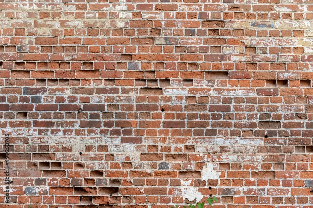 Naklejka premium Shabby wall of old red brick. Reference material, reference information.