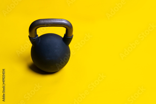 Black space isolated yellow kettlebell ackground fitness cast dumbbell, from equipment sport for steel for athletic red, knockout winner. Sportswear fighter boxer, rivalry