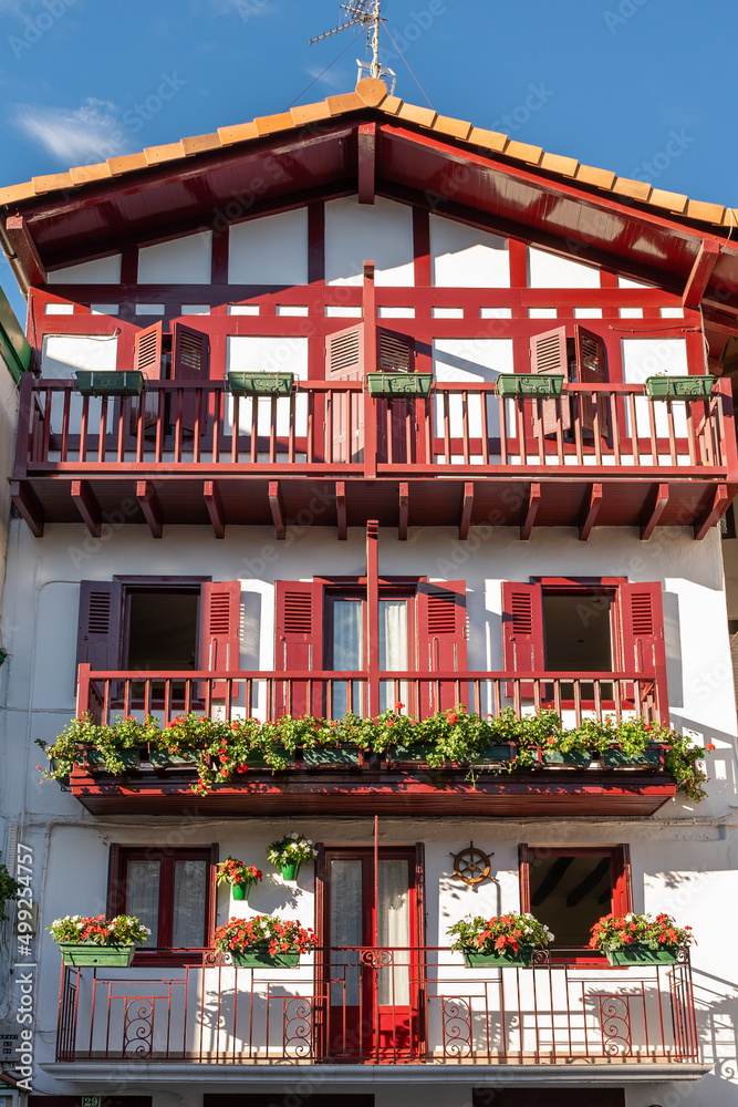facade of charming rural houses decorated with flowerpots facade of charming rural houses decorated with flowerpots