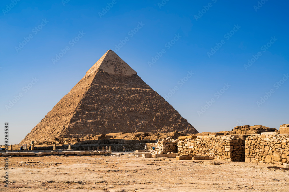 The great Pyramid of Kefren with a clear blue sky. Photograph taken in Cairo, Egypt. The great Pyramid of Kefren with a clear blue sky. Photograph taken in Cairo, Egypt.