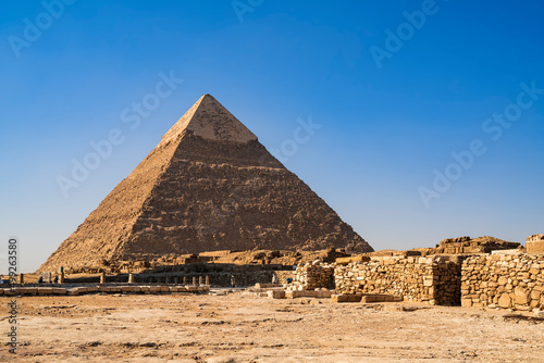 The great Pyramid of Kefren with a clear blue sky. Photograph taken in Cairo, Egypt.