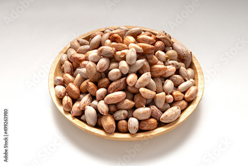 Peanut on wood dish. food background of peanuts.Delicious snacks.