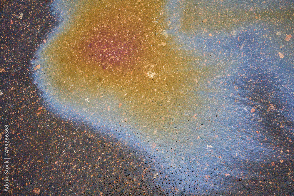 Oil stain, Gas Stain drop from the Car on the Parking Lot Floor Oil stain, Gas Stain drop from the Car on the Parking Lot Floor