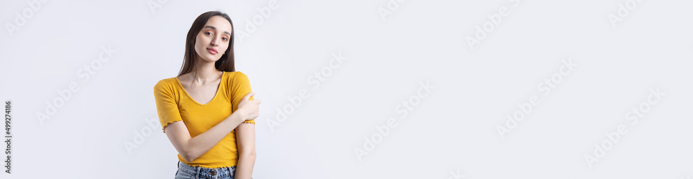 Portrait of a beautiful young woman thinking, isolated on concrete background Portrait of a beautiful young woman thinking, isolated on concrete background