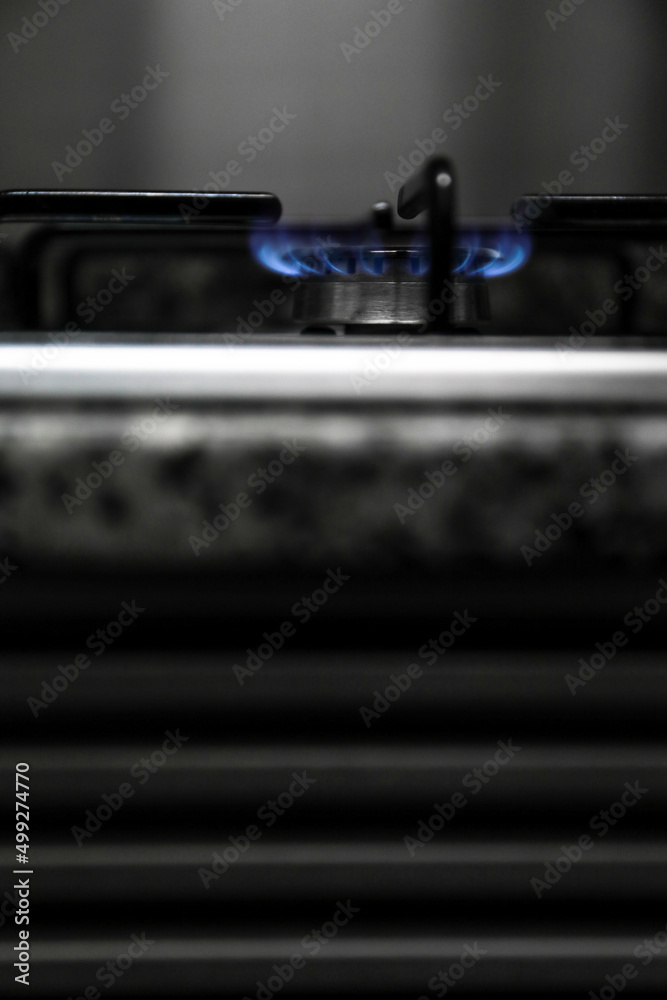 Gas stove, some stoves lit with a match with fire, to cook a good meal in the kitchen Gas stove, some stoves lit with a match with fire, to cook a good meal in the kitchen