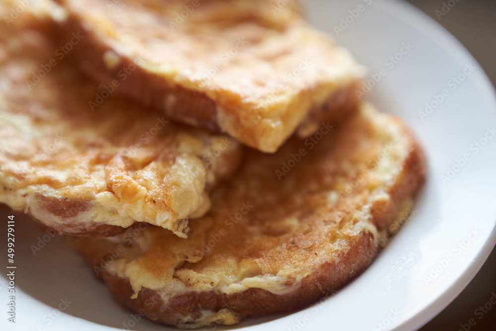 Close-up of delicious egg sandwiches in a white plate. The concept of a quick breakfast