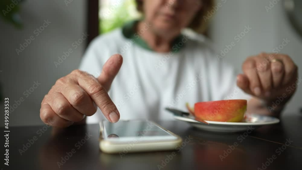 Person browsing internet touching cellphone screen scrolling page